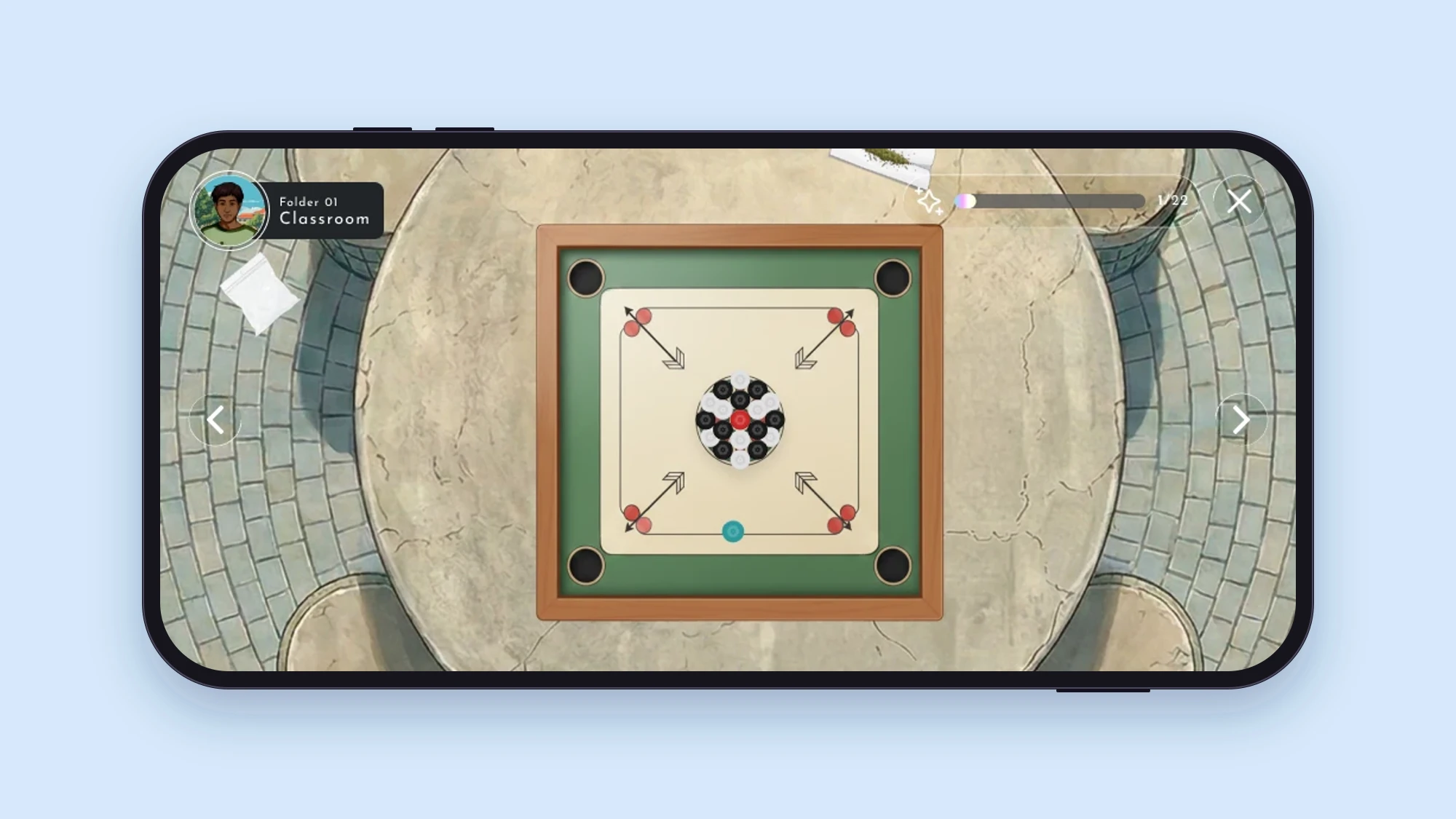 A carrom board on a stone table in the Classroom folder, with arrows showing where to flick the pieces and a small bag of powder beside the table